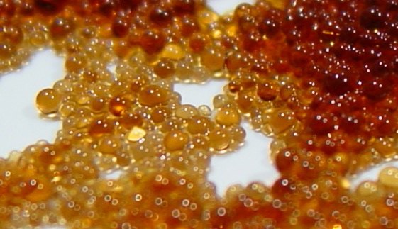 Close-up of amber resin beads